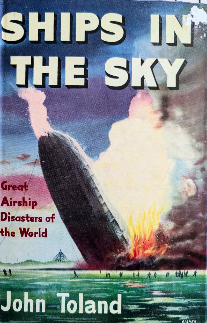 Picture of colour pictorial book cover showing The Hindenberg Airship on fire sinking to the ground with people running beneath.